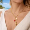 Collier acier doré coquillage et poisson