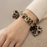 Bracelet ruban motif léopard et acier doré