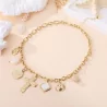 Collier chaîne dorée breloques soleil et croix