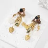Boucles d’oreilles bohèmes coquillages pampilles dorées
