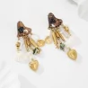 Boucles d’oreilles bohèmes coquillages pampilles dorées