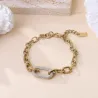 Bracelet doré avec maillon ovale et strass