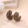 Boucles d’oreilles créoles dorées motif serpent