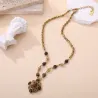 Collier doré à pendentif pierres marron