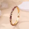 Bracelet jonc doré à motifs et strass