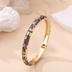 Bracelet jonc doré à motifs et strass