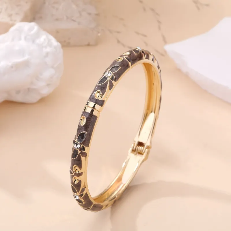 Bracelet jonc doré à motifs et strass