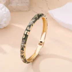 Bracelet jonc doré à motifs et strass