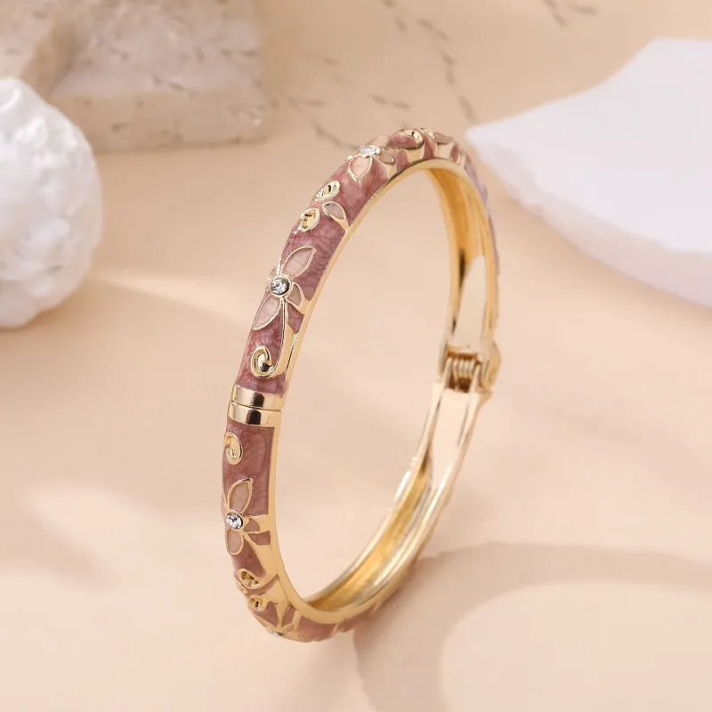 Bracelet jonc doré à motifs et strass