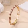 Bracelet jonc doré à motifs et strass