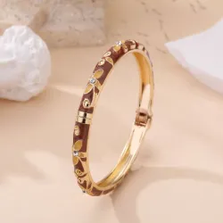 Bracelet jonc doré à motifs et strass