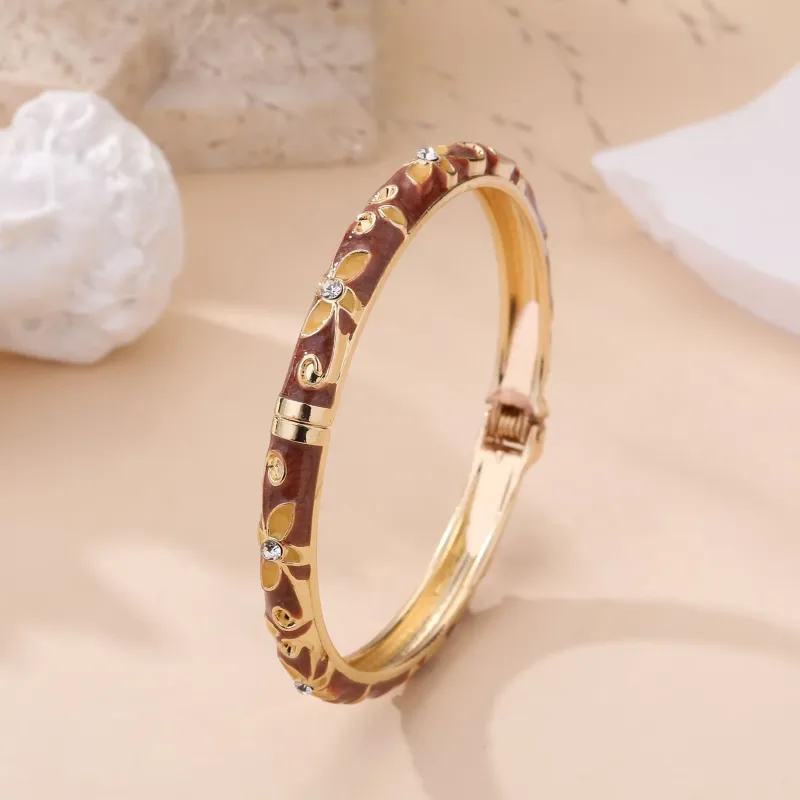 Bracelet jonc doré à motifs et strass