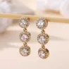 Boucles d’oreilles pendantes dorées avec strass