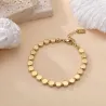 Bracelet en acier inoxydable doré – Pastilles rondes et perles