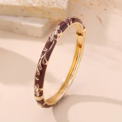 Bracelet jonc doré émaillé à motifs fleuris et strass