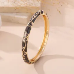 Bracelet jonc doré émaillé à motifs fleuris et strass