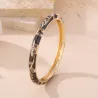 Bracelet jonc doré émaillé à motifs fleuris et strass