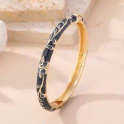 Bracelet jonc doré émaillé à motifs fleuris et strass