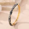 Bracelet jonc doré émaillé à motifs fleuris et strass