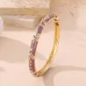 Bracelet jonc doré émaillé à motifs fleuris et strass