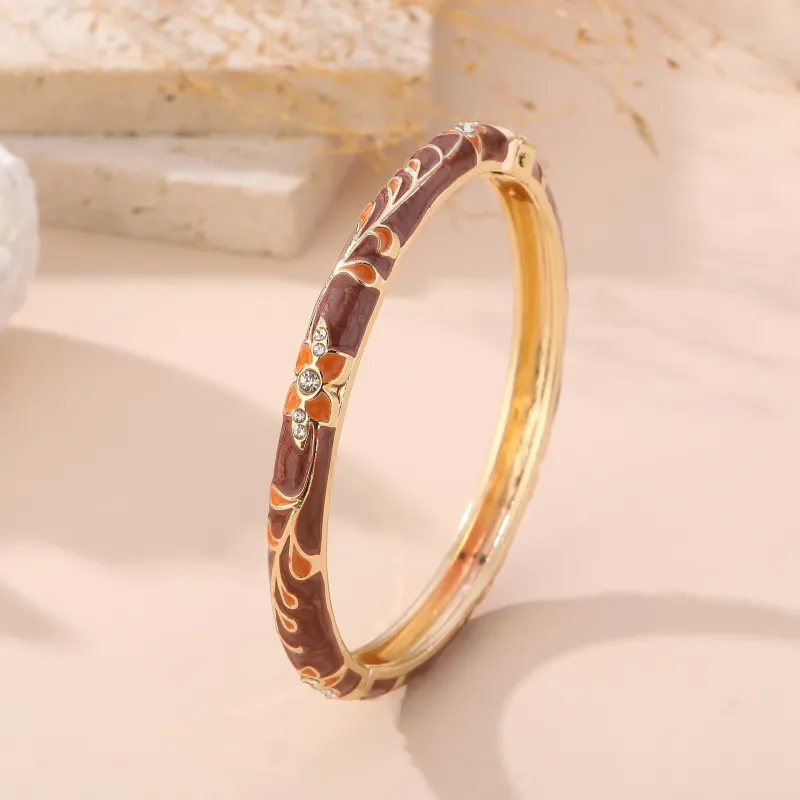 Bracelet jonc doré émaillé à motifs fleuris et strass
