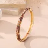 Bracelet jonc doré émaillé à motifs fleuris et strass