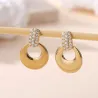 Boucles d’oreilles dorées pendantes ronds et strass