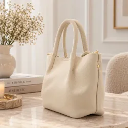 Sac à main avec pompons et bandoulière